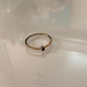 Gold ring with black stone